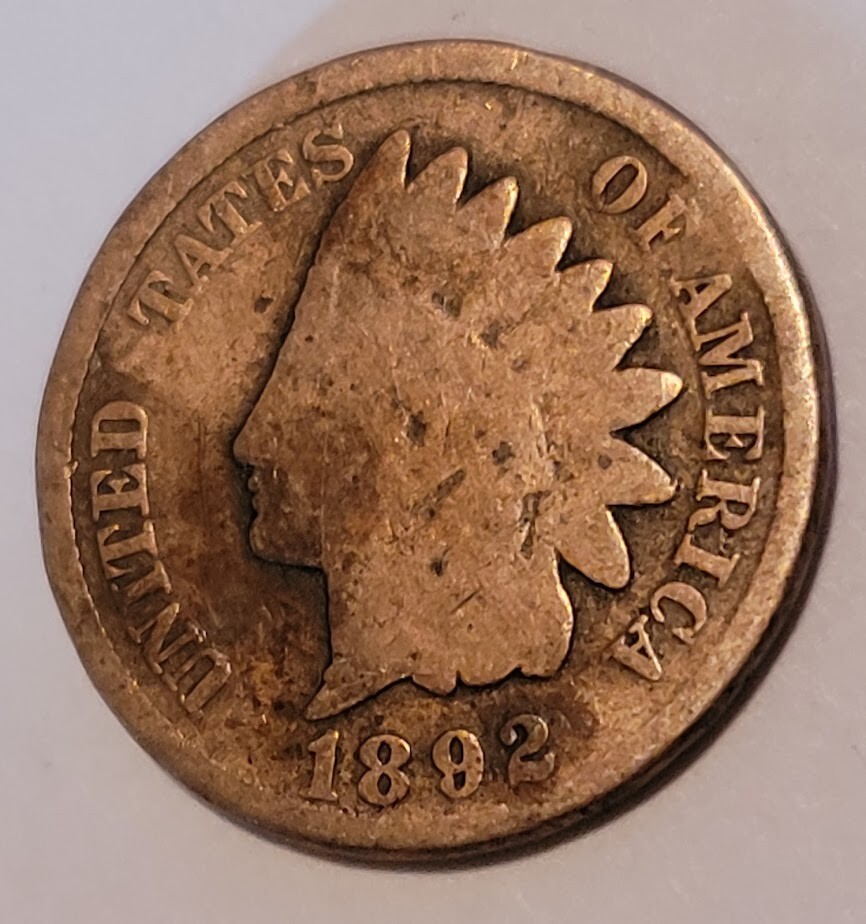 1892 Indian Head penny off-center mint strike error showing blank planchet crescent with date visible
